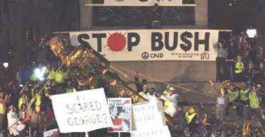 Protesters in London topple an effigy of George Bush